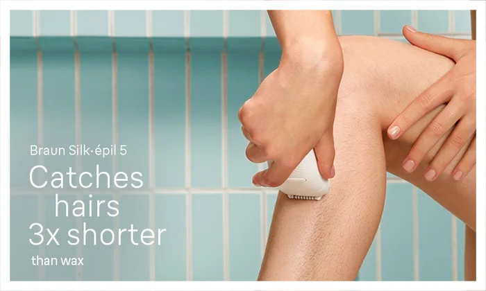 Braun Silk epil 5 being used in a bathroom to epilate a lady's legs. Catches hairs 3x shorter than wax.